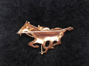 Brooch Polo Player in Mid Swing on Galloping Horse with a Ruby Eye Form 14kt Gold